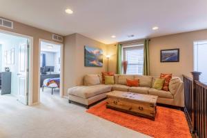 a living room with a couch and a coffee table at Spacious Family Friendly Townhome in Central Park in Denver