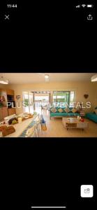 a large living room with couches and tables at Villa 4 in Ayia Thekla in Ayia Napa