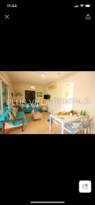 a living room with a couch and a table at Villa 4 in Ayia Thekla in Ayia Napa