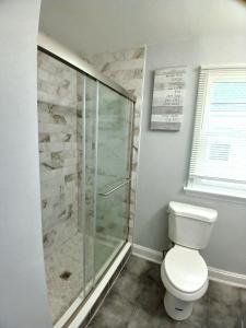 a bathroom with a shower and a toilet at Luxury & Restful Private Room in DC in Washington