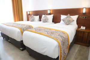 Postel nebo postele na pokoji v ubytování Ceylon Ayu Resort Kandy