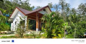 a house in the middle of a forest at Mookies Bungalows in Ko Mook