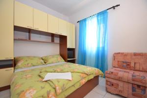מיטה או מיטות בחדר ב-Apartments Tota