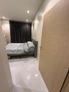 Postel nebo postele na pokoji v ubytování Cozy Separate Apartment in Muscat