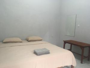 Postel nebo postele na pokoji v ubytování Smiley's Homestay