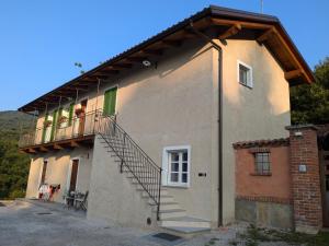 a group of people on a balcony of a house at Il Boschetto della Valle Maira in Villar San Costanzo