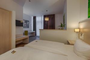 Postel nebo postele na pokoji v ubytování Hotel Fürsteneck