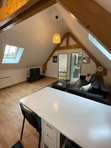 Χώρος καθιστικού στο Logement à 5 min du parc Astérix