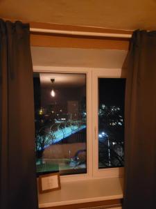 a window with a view of a bridge at Gaujas naktsmājas in Valmiera