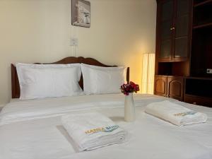 Apamet Hotel Sukhumvit 55客房内的一张或多张床位