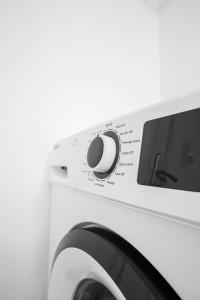 a close up of a washing machine at Appartement Moderne Centre ville BZV in Brazzaville +16 photos