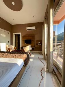 Postel nebo postele na pokoji v ubytování Hotel Viva La Vida