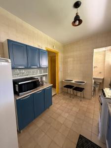 Kuchyň nebo kuchyňský kout v ubytování Apartamento 1 quarto Aconchegante em Águas de Lindóia