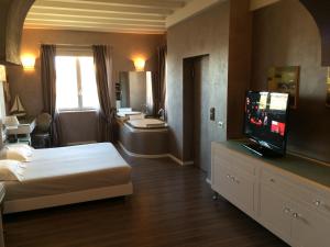 Postel nebo postele na pokoji v ubytování Hotel Morgana