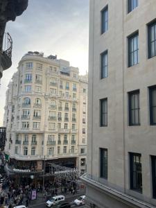 a view of a large building in a city at Grand Via House in Madrid