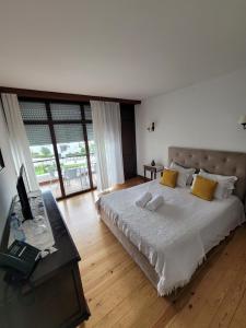 Giường trong phòng chung tại Boutique Inn & Restaurant - Casa dos Suécos
