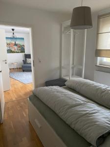 a bedroom with a bed and a living room at Apartment im Herzen von Thurnau in Thurnau