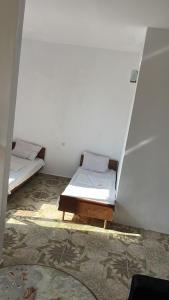 Postel nebo postele na pokoji v ubytování Olympia Ureki Guria Street 24-26