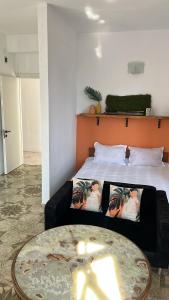 Postel nebo postele na pokoji v ubytování Olympia Ureki Guria Street 24-26
