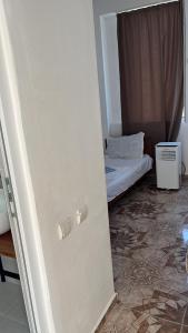 Postel nebo postele na pokoji v ubytování Olympia Ureki Guria Street 24-26