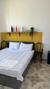 Postel nebo postele na pokoji v ubytování Olympia Ureki Guria Street 24-26
