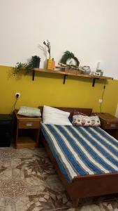 Postel nebo postele na pokoji v ubytování Olympia Ureki Guria Street 24-26