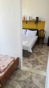 Postel nebo postele na pokoji v ubytování Olympia Ureki Guria Street 24-26