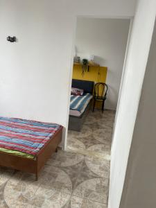 Postel nebo postele na pokoji v ubytování Olympia Ureki Guria Street 24-26