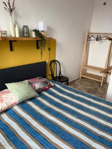 Postel nebo postele na pokoji v ubytování Olympia Ureki Guria Street 24-26