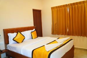 Postel nebo postele na pokoji v ubytování UJ Pallazzio - Business Class Luxury Hotel