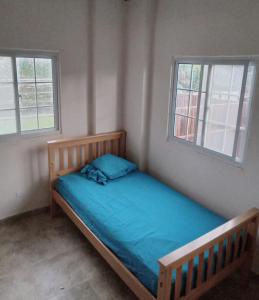 Postel nebo postele na pokoji v ubytování Casa Azul Miguel de la Borda
