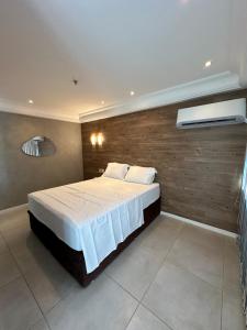 En eller flere senge i et værelse på Mediterrâneo flat 1309 + 7 billeder