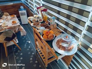 a table full of food on a balcony at La Cerasa in Contigliano