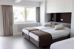 Postel nebo postele na pokoji v ubytování Rewindhotel