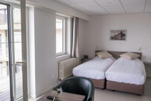 Postel nebo postele na pokoji v ubytování Rewindhotel