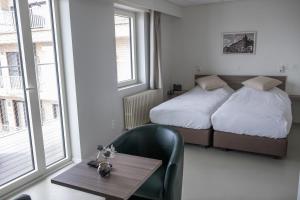 Postel nebo postele na pokoji v ubytování Rewindhotel