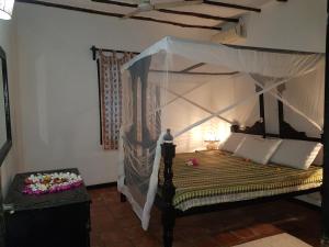 The Foxy Nests of Karibuni - Villa 184 & 145客房内的一张或多张床位