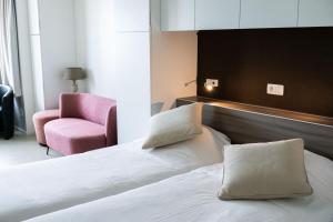 Postel nebo postele na pokoji v ubytování Rewindhotel