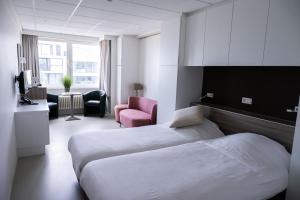 Postel nebo postele na pokoji v ubytování Rewindhotel