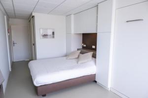 Postel nebo postele na pokoji v ubytování Rewindhotel