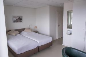 Postel nebo postele na pokoji v ubytování Rewindhotel