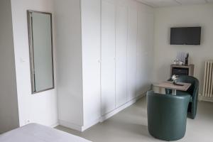 TV a/nebo společenská místnost v ubytování Rewindhotel
