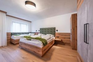 Ένα ή περισσότερα κρεβάτια σε δωμάτιο στο Apart Kreuzjoch +109 φωτογραφίες