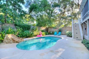 a swimming pool in the backyard of a home at Watermark - 637 Demere Way in Demere Park