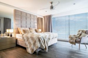 Ένα ή περισσότερα κρεβάτια σε δωμάτιο στο SUPERVILLA Liptov +63 φωτογραφίες