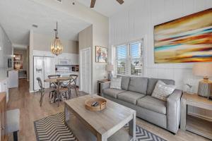 a living room with a couch and a table at Windemere 301 in Perdido Key
