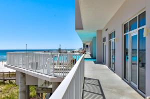 a balcony with a view of the beach at Windemere 301 in Perdido Key