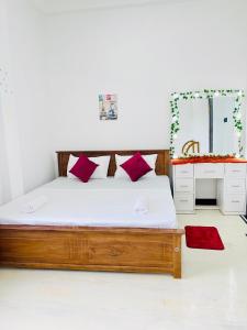 Ένα ή περισσότερα κρεβάτια σε δωμάτιο στο Sleepy Heaven Negombo