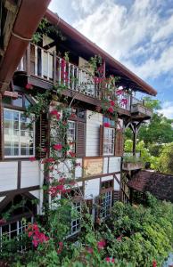a building with flowers on the side of it at Greenheart Boutique Hotel in Paramaribo