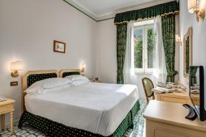 Cama ou camas em um quarto em Imperial Hotel Tramontano
